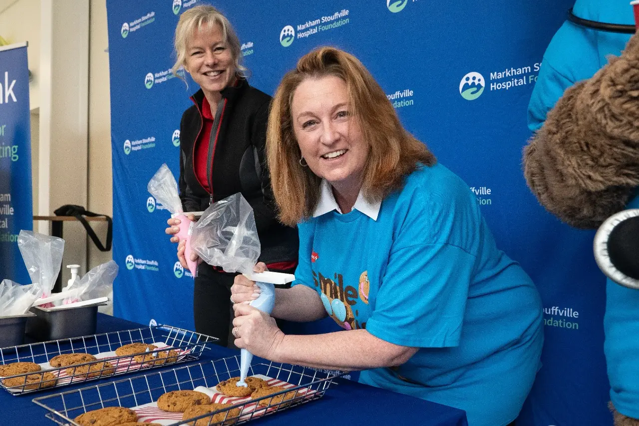 Gillian Fintleman & Suzette Strong piping smile cookies