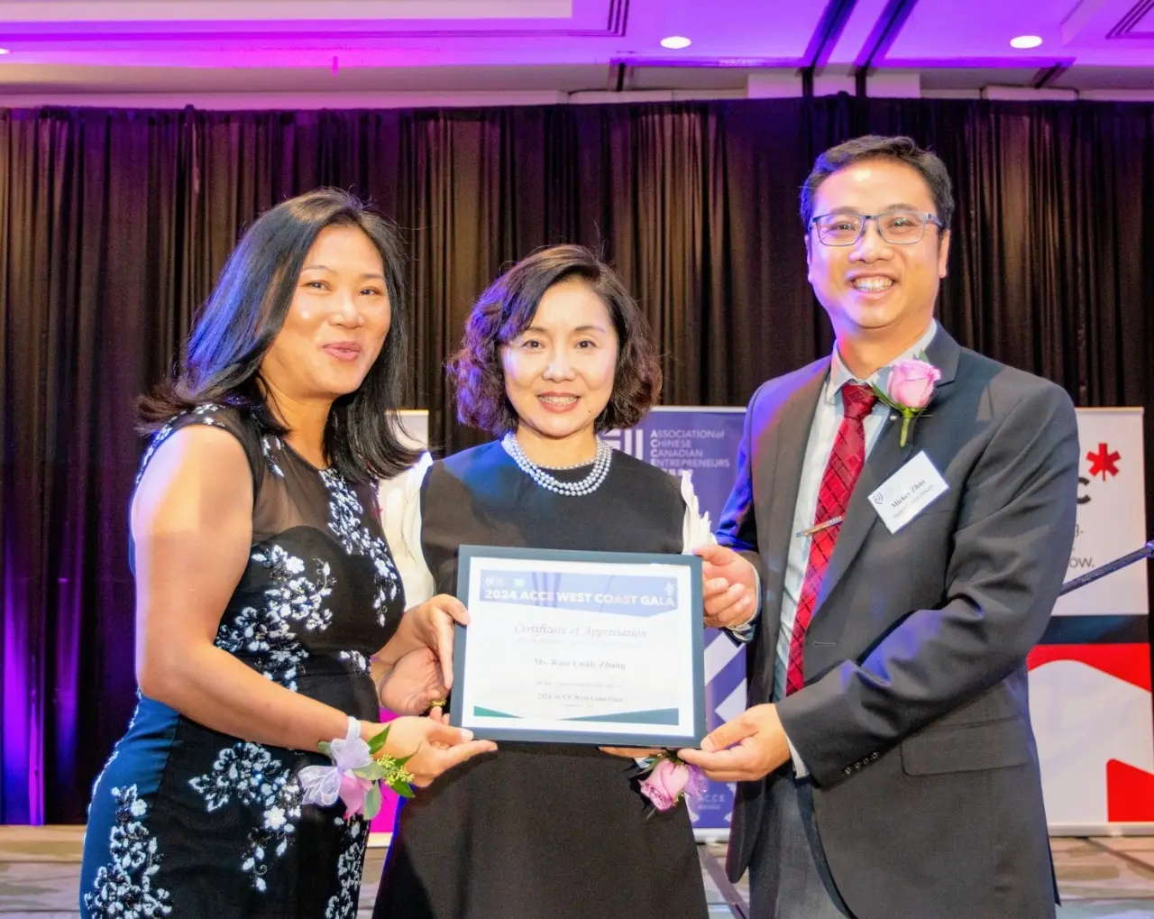 ACCE_2024_Vancouver_Gala_president_Chan_and_cochair_Zhou_presented_appreciation_plaque_to_keynote_speaker_Ms_Zhang