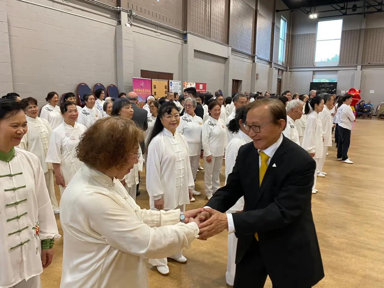 Raymond Cho greeted with Tai Chi instructor